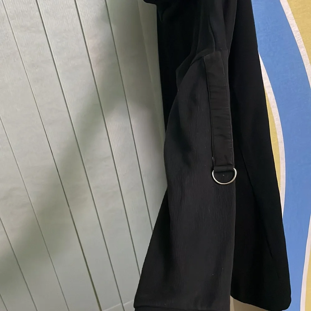 That is a sweatshirt. It is long and very black. - Picture 4 of 4